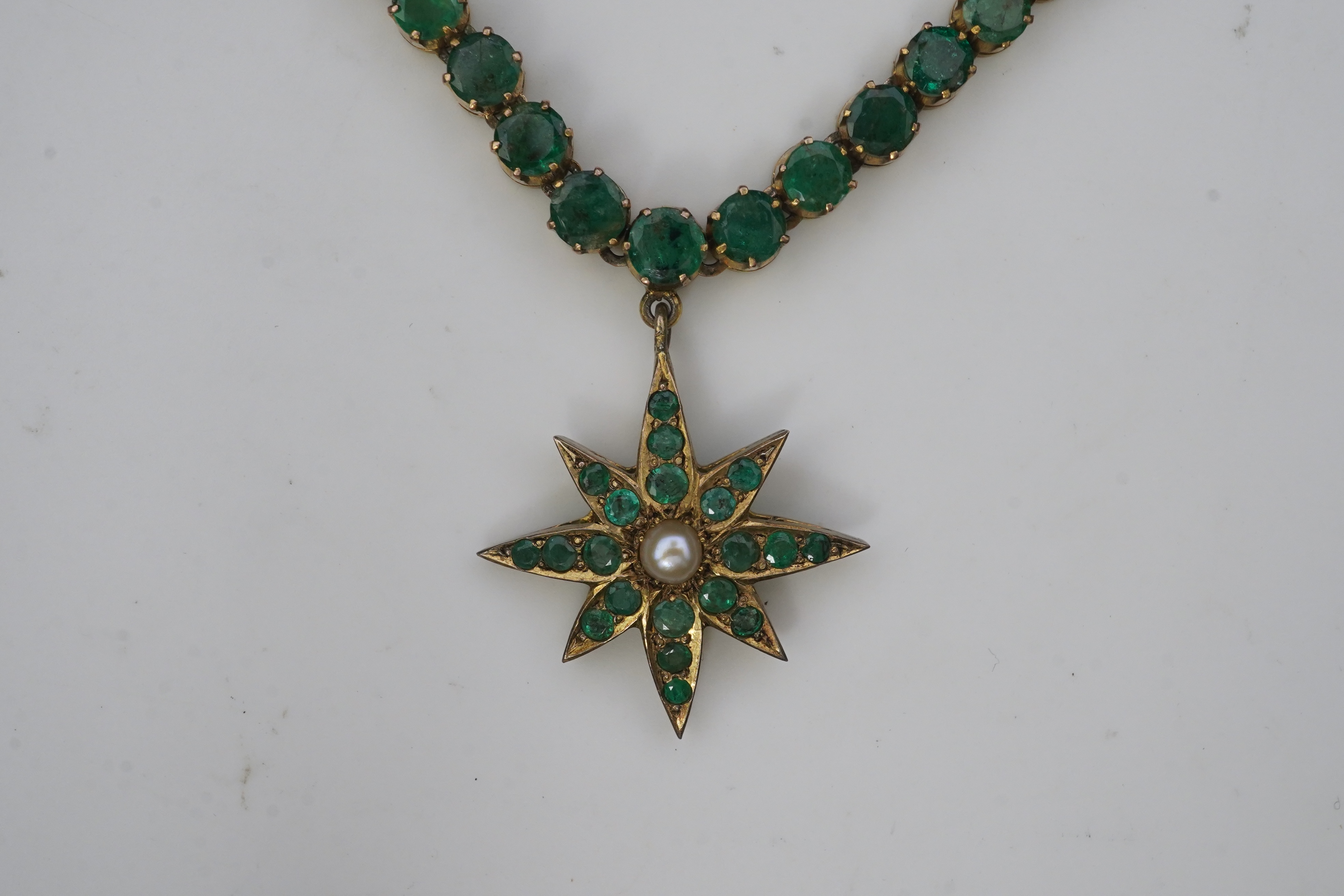 An emerald and pearl necklace